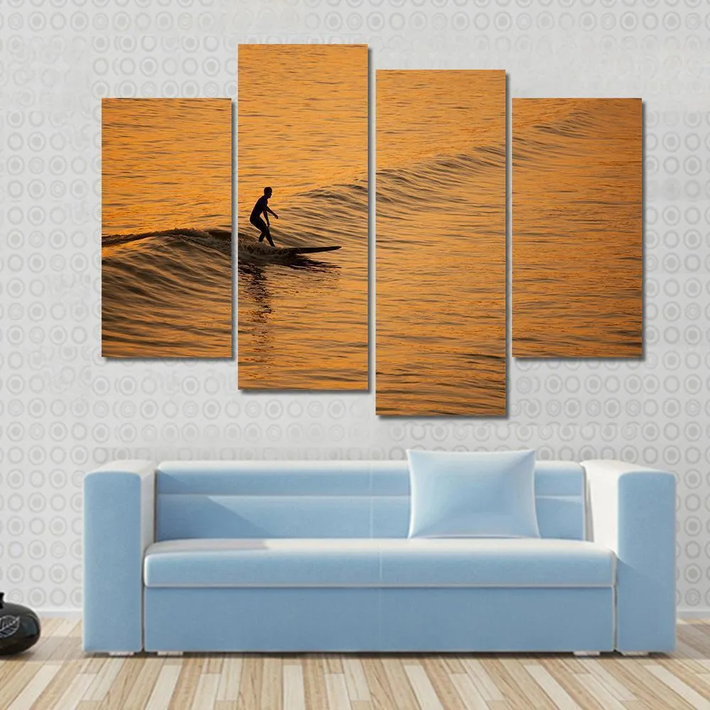 Single Surfer At Sunset On A Calm Ocean Canvas Wall Art