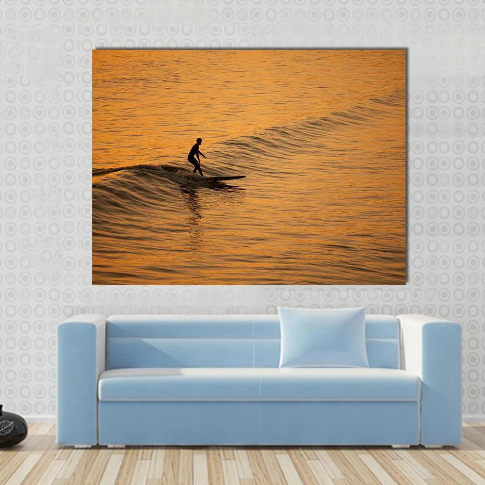 Single Surfer At Sunset On A Calm Ocean Canvas Wall Art