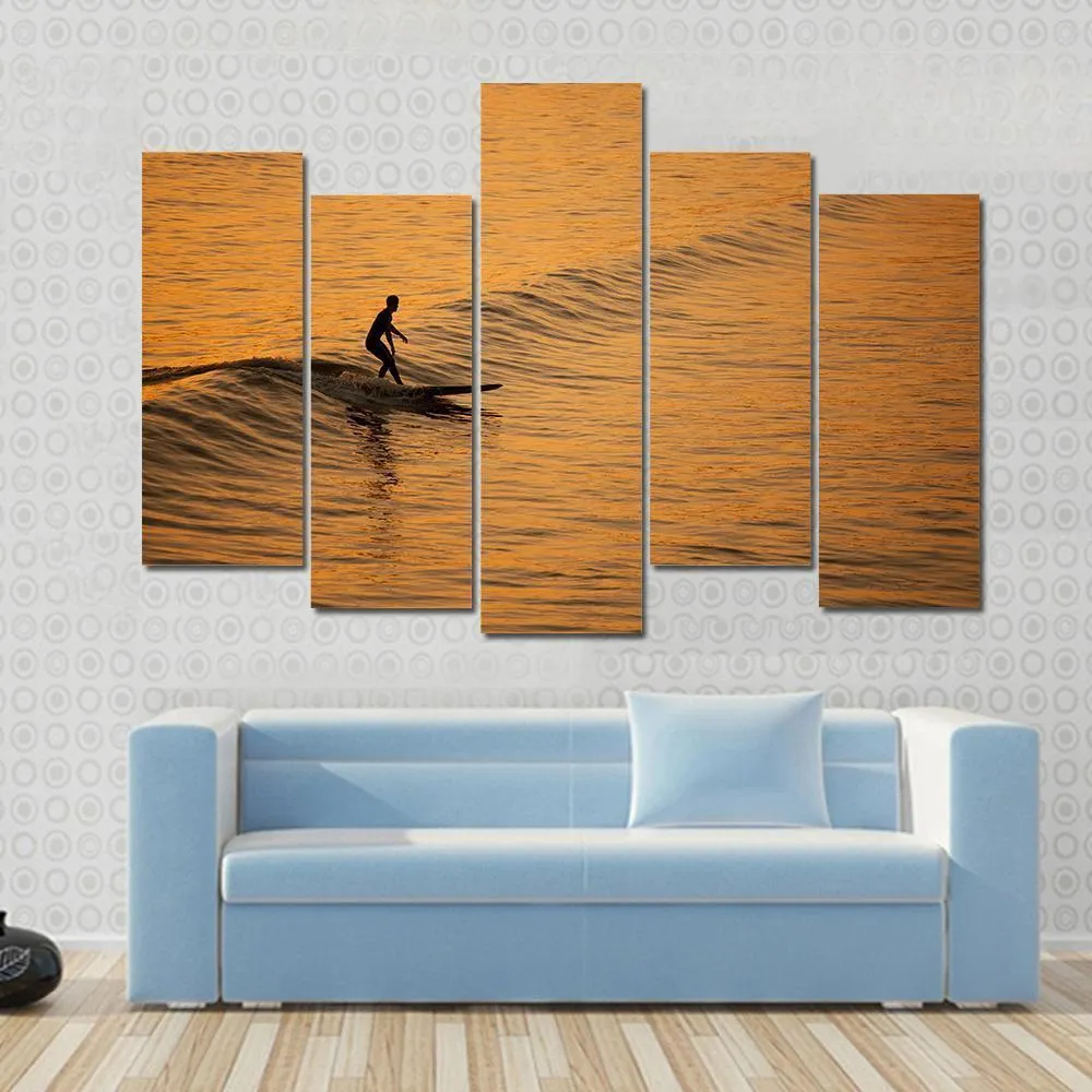 Single Surfer At Sunset On A Calm Ocean Canvas Wall Art