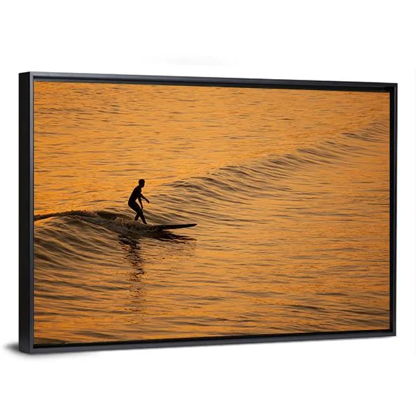 Single Surfer At Sunset On A Calm Ocean Canvas Wall Art