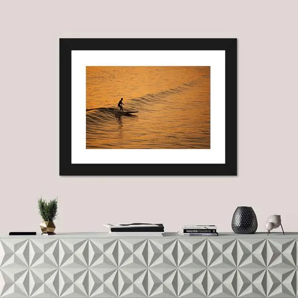 Single Surfer At Sunset On A Calm Ocean Canvas Wall Art