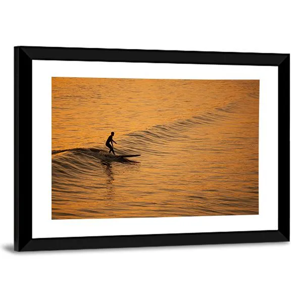 Single Surfer At Sunset On A Calm Ocean Canvas Wall Art