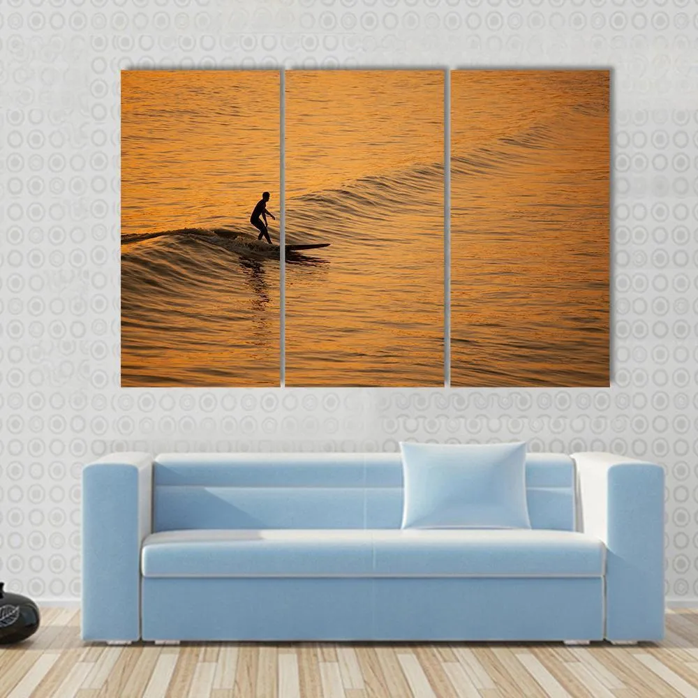 Single Surfer At Sunset On A Calm Ocean Canvas Wall Art