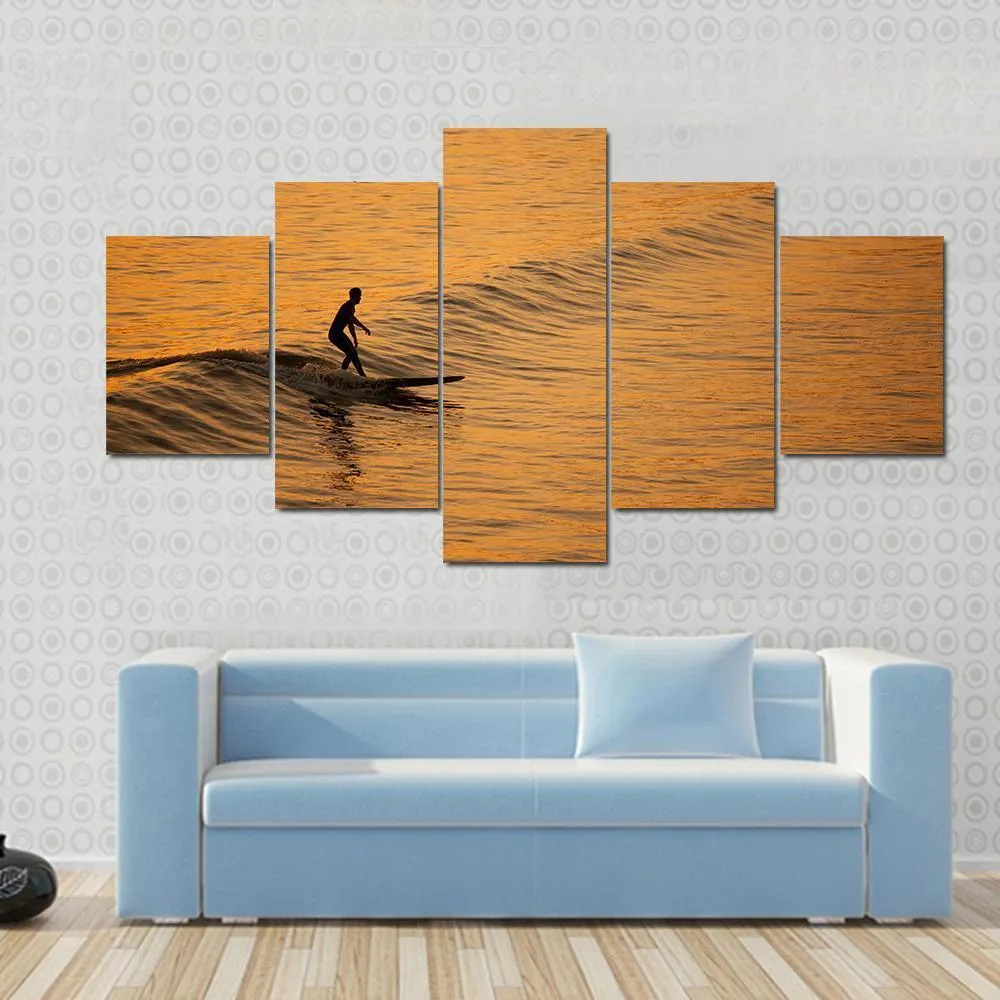 Single Surfer At Sunset On A Calm Ocean Canvas Wall Art