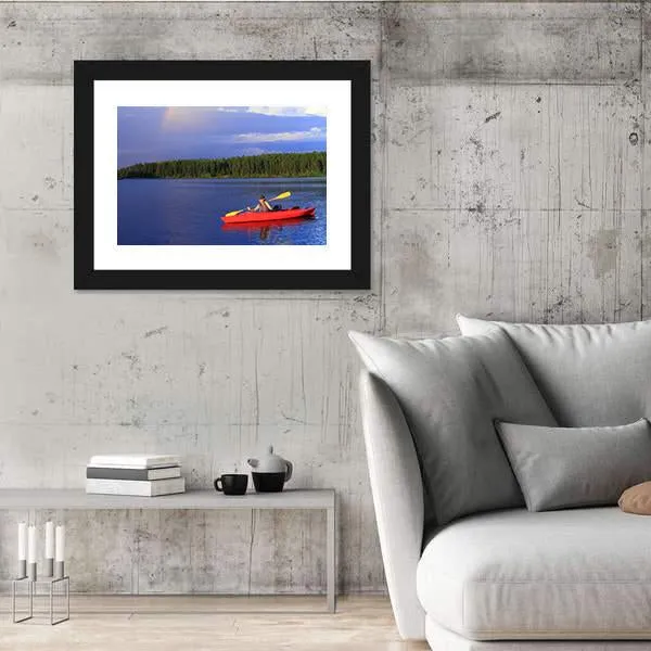 Woman Canoeing In A Beautiful Lake Canvas Wall Art