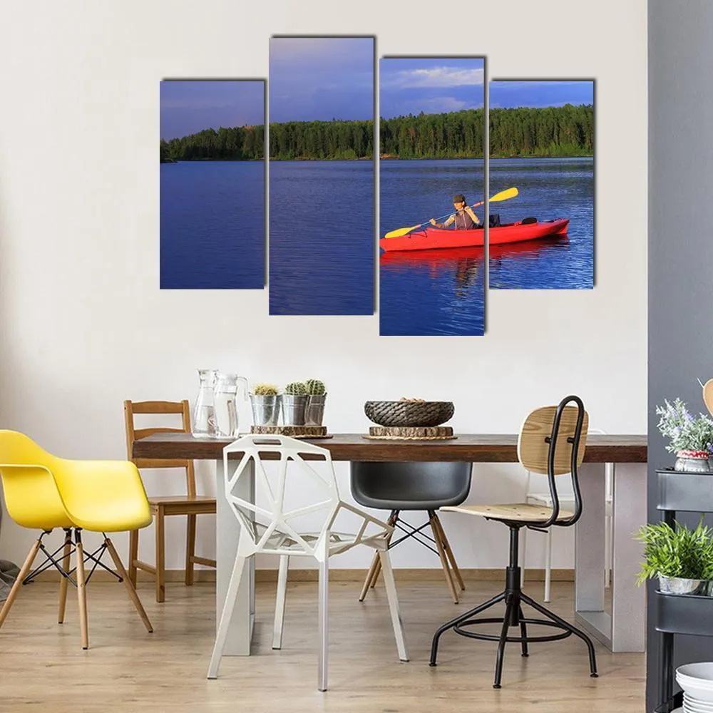 Woman Canoeing In A Beautiful Lake Canvas Wall Art