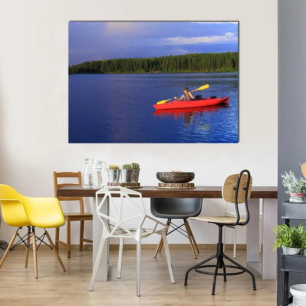 Woman Canoeing In A Beautiful Lake Canvas Wall Art