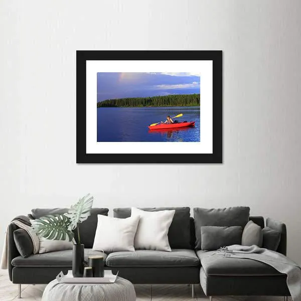 Woman Canoeing In A Beautiful Lake Canvas Wall Art