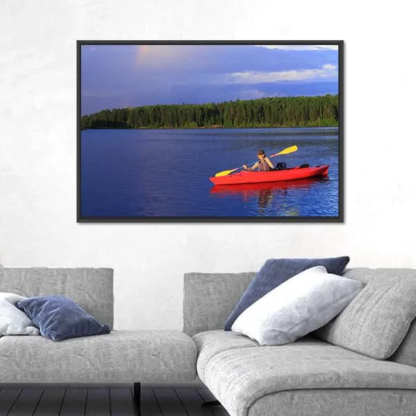 Woman Canoeing In A Beautiful Lake Canvas Wall Art