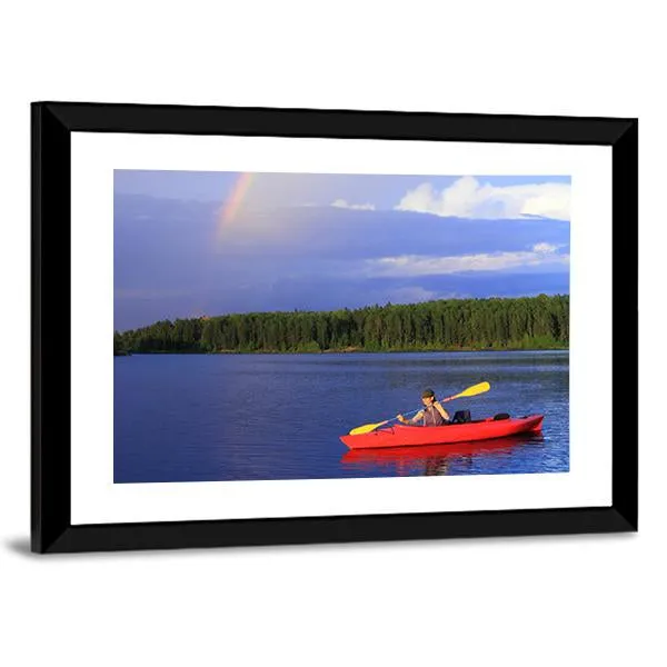 Woman Canoeing In A Beautiful Lake Canvas Wall Art