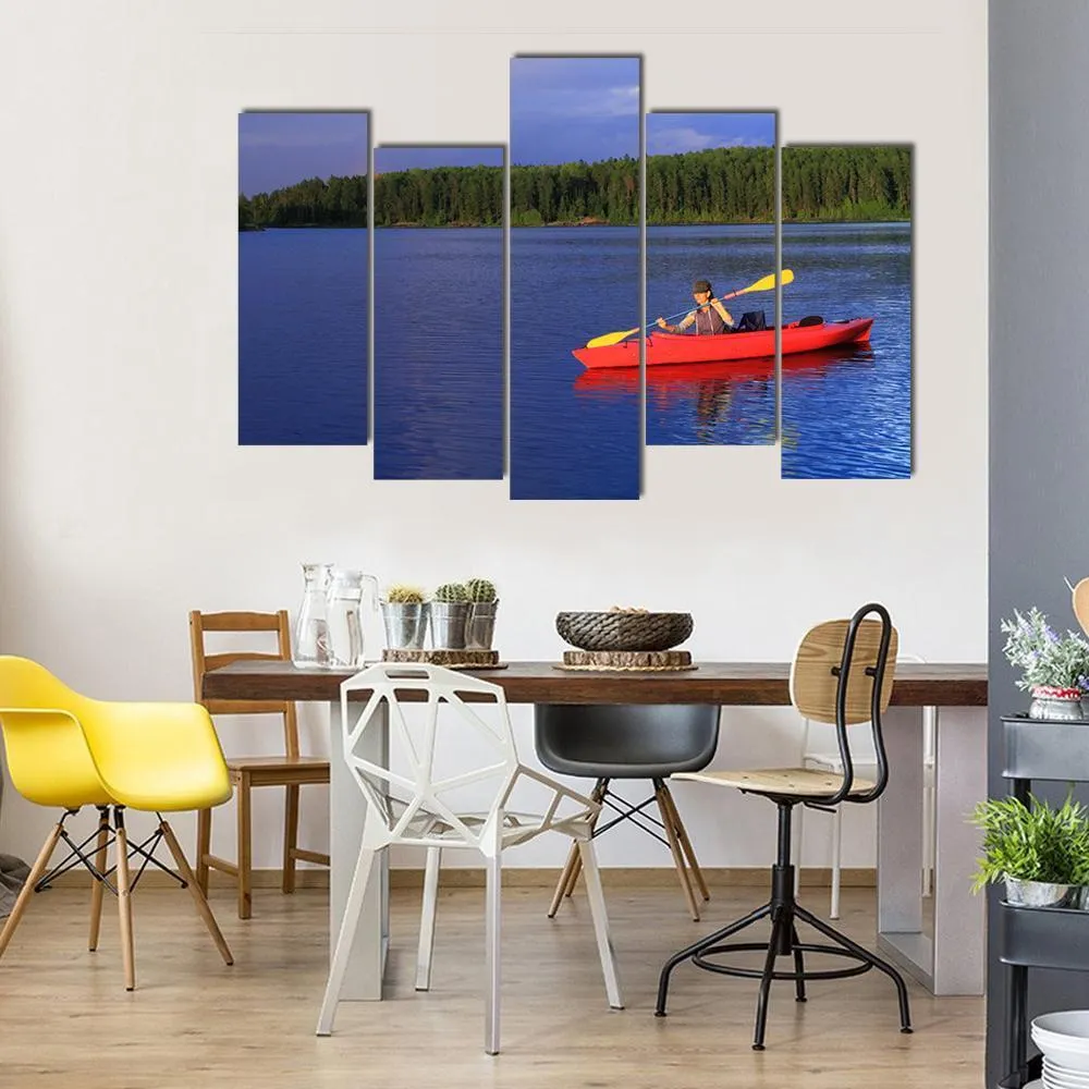 Woman Canoeing In A Beautiful Lake Canvas Wall Art