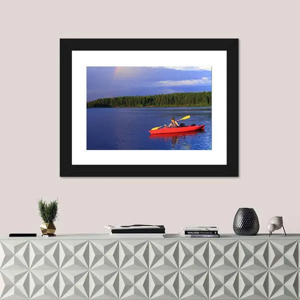 Woman Canoeing In A Beautiful Lake Canvas Wall Art